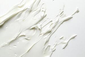 The image captures heavy cream spread across a textured surface, revealing its rich and creamy consistency. This versatile ingredient is often used in various culinary applications. photo