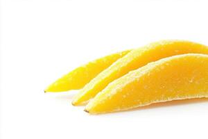 Three vibrant dried mango slices are neatly placed on a pristine white surface, showcasing their bright yellow color and natural texture, perfect for healthy snacking or culinary uses. photo