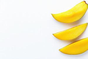 Dried mango slices are displayed in a clean arrangement on a solid white background, showcasing their vibrant yellow color and natural shape, perfect for snacking or culinary use. photo