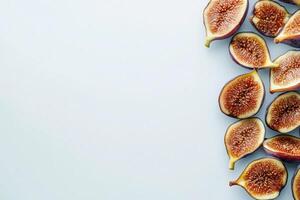 A collection of dried figs lies neatly on a white surface, showcasing their rich texture and color. These fruits highlight their natural sweetness and are ideal for various health-conscious recipes. photo