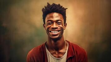 a young African man beams with a smile against a warm brown background. photo