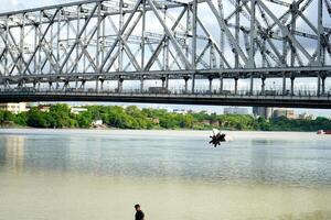 Capturing Howrah Bridge during daytime in clear weather photo