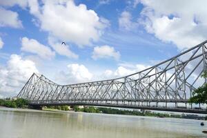A View of Howrah Bridge with Sunny weather and holy river Ganga photo