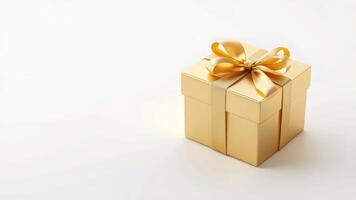 Gold gift box with ribbon and bow on white background photo