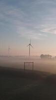 Wind turbines in the morning mist video