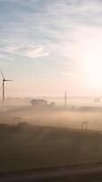Wind turbines in the fog video