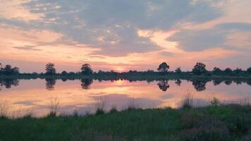 A lake with a sunset in the background video