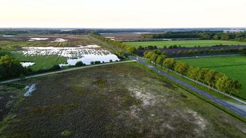 An aerial view of a field and a road video
