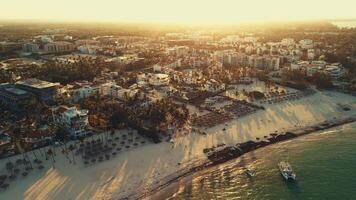 Aerial view of the Bavaro resort with a public white sand beach.Turquoise waters of the Caribbean Sea, a tropical paradise in the rays of the setting sun, Punta Cana, Dominican Republic.Boat trips video