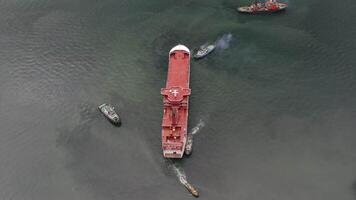 Tugs mooring the ferry that arrived at the port for completion at the shipyard video