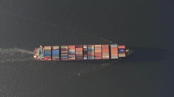 Drone view vertically downward on the movement of the container ship at sea video