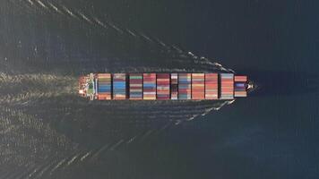 Drone view vertically downward on the movement of the container ship at sea video
