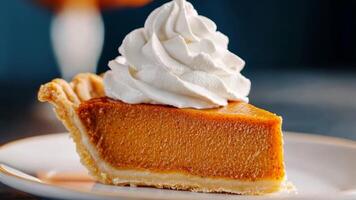 A slice of pumpkin pie topped with whipped cream, perfect for Thanksgiving and autumn celebrations video