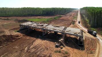Construction team in hard hats work at the construction site aerial view. Builders in the process of work. Construction of an overpass and a bridge. Republic of Tatarstan, Kazan, August 18, 2023 video