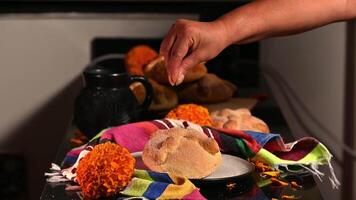 Pan de Muerto. Typical Mexican sweet bread that is consumed in the season of the day of the dead. It is a main element in the altars and offerings in the festivity of the day of the dead. video