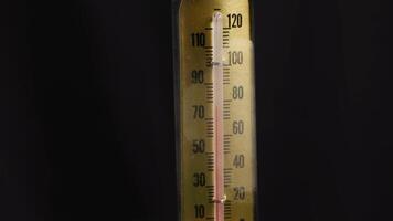 Close-up of 78 degrees thermometer rotating on turntable temperature measurement video