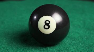 8 ball turning on green billiards table spinning shot video