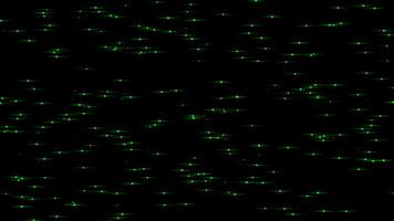 Green color tiny small glowing and flickering particles slowly moving on black background video