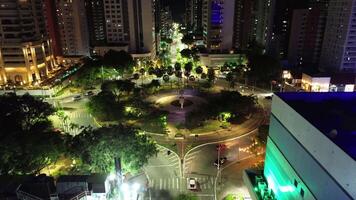 Aerial of the night city with a night square with several trees video