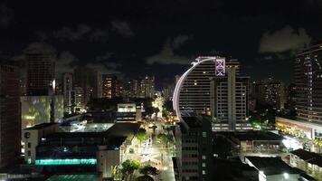 Night scene of city avenue with illuminated building in the background video