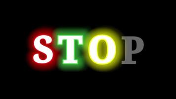 Stop text with neon glow effect on black background. colorful neon text. video