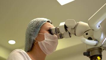 Dentist Operates Through Microscope video
