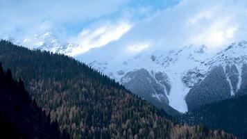 Panorama Of A Large White Mountain In The Fog Near Forest Trees video