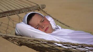 A Boy In A Hammock On A Sunny Summer Day video