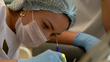 Dentist At Work With Assistant video