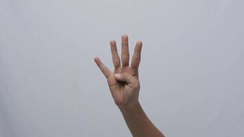 Woman hands showing counting with fingers on white background and closed with waving hand video
