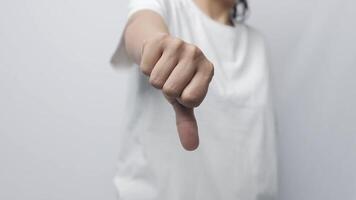 Close up hand showing thumbs down gesture, disapproval negative result, dissatisfied with service demonstrate sign video