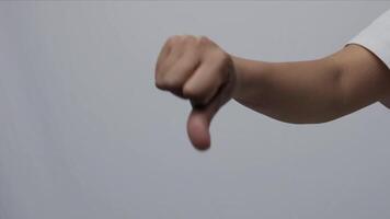 Close up hand showing thumbs down gesture, disapproval negative result, dissatisfied with service demonstrate sign video