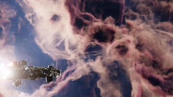 Deep Space Exploration concept. Side view Spaceship flying through nebula or galaxy clouds. Seamles loop, 3d render. video