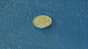 20 cent euro coin falls on surface in grid pattern video