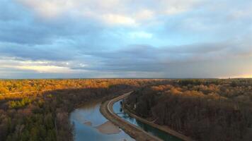 Aerial view of Isar River in Munich, Germany Upper Bavaria at sunset in sunny autumn weather. Drone view of Isar River in Muenchen at sundown in bright spring time. Luftaufnahme der Isar in Munchen. video