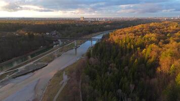 Grosshesseloher Brucke on Isar River in Munich, Germany aerial view. Two-story railroad and pedestrian bridge in Munchen over Isar River. Eisenbahnbrucke. Bike path runs under Railroad tracks. video