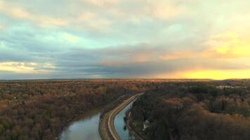 Aerial view of Isar River in Munich, Germany Upper Bavaria at sunset in sunny autumn weather. Drone view of Isar River in Muenchen at sundown in bright spring time. Luftaufnahme der Isar in Munchen. video