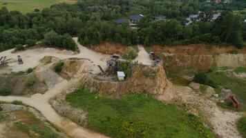 Aerial view of an abandoned mining quarry in Germany im Landkreis Dillingen. Open pit mines drone view. Steinbruch Luftaufnahme in Deutschland, Bayern in der Stadt Haunsheim. Mining equipment. video