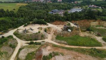 Aerial view of an abandoned mining quarry in Germany im Landkreis Dillingen. Open pit mines drone view. Steinbruch Luftaufnahme in Deutschland, Bayern in der Stadt Haunsheim. Mining equipment. video