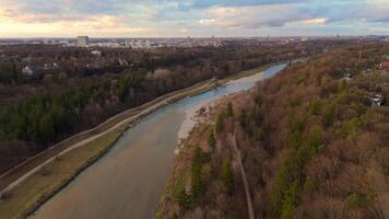 Aerial view of Isar River in Munich, Germany Upper Bavaria at sunset in sunny autumn weather. Drone view of Isar River in Muenchen at sundown in bright spring time. Luftaufnahme der Isar in Munchen. video