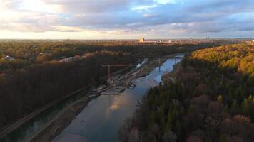 Grosshesseloher Brucke on Isar River in Munich, Germany aerial view. Two-story railroad and pedestrian bridge in Munchen over Isar River. Eisenbahnbrucke. Bike path runs under Railroad tracks. video