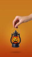 Looped static Halloween lamp glows in a womans hand. Vertical banner copy space orange background video