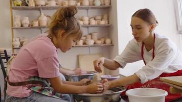 Creating pottery together at an art studio with children and adults video