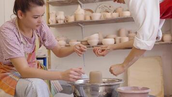 Creating pottery in a studio with skilled instructor at afternoon class video