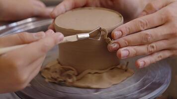 Learning pottery skills in a cozy studio during a weekend workshop video