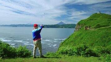 Discovering Beautiful Natural Landmarks, Man Photographing Sea Shore From Mount, Traveler At Top video