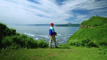 Unity Of Person And Nature, Man Standing Alone In Highland And Admiring Scenery, Taking Photo video