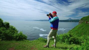 Male Tourist Rest In Mountains And Photographing Nature By Professional Camera, Birdwatching video