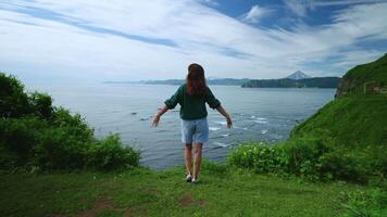Beautiful Scenery With Ocean And Mountains, Happy Young Woman Stretching Hands Up video