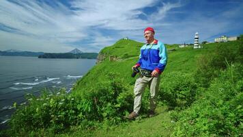 Happy Traveler Admiring Beauty Of Ocean From Mount On Coast, Photographing Seascape, Portrait video